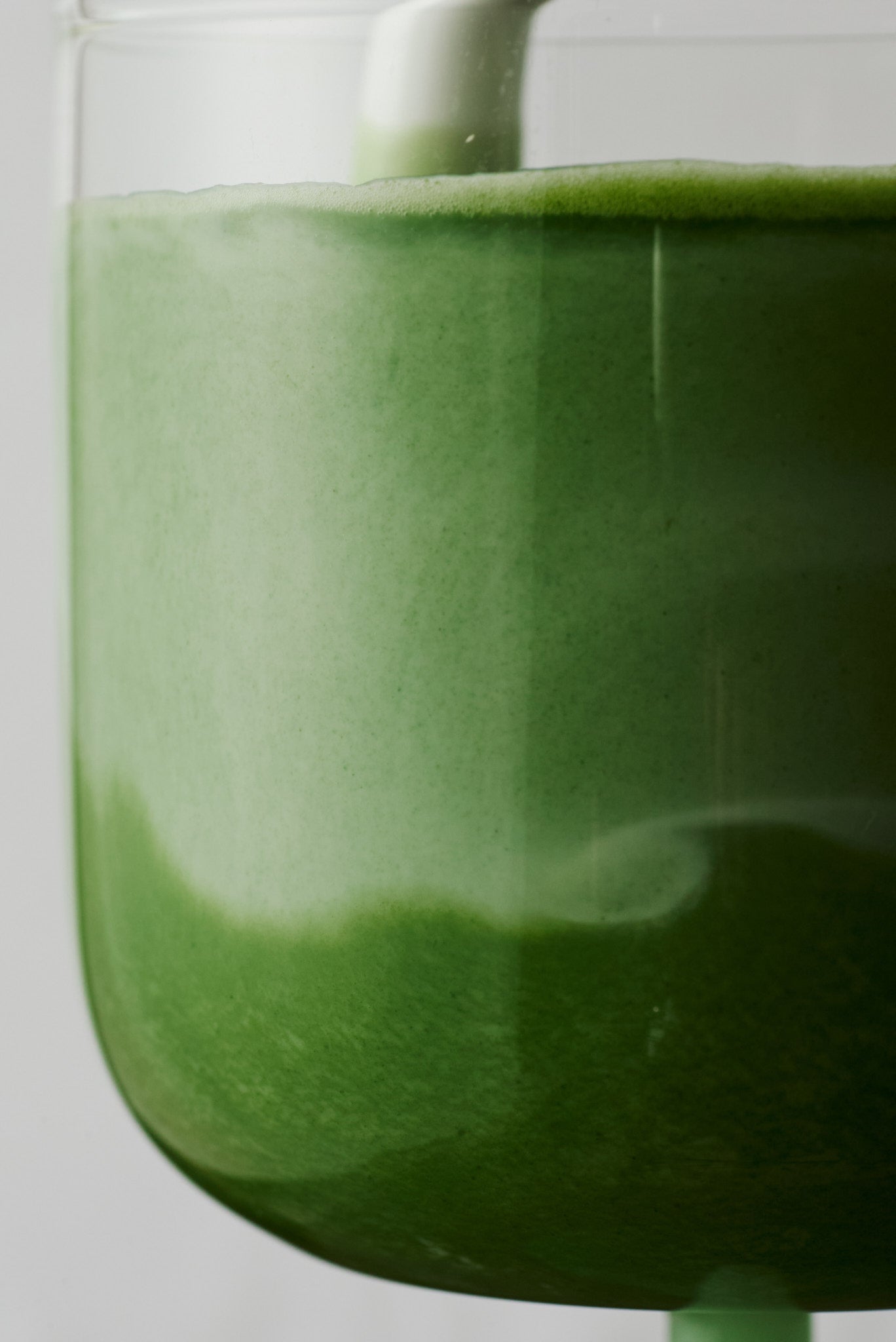 Rich green matcha in glass, NAKAI 212 ceremonial grade Japanese green tea close-up